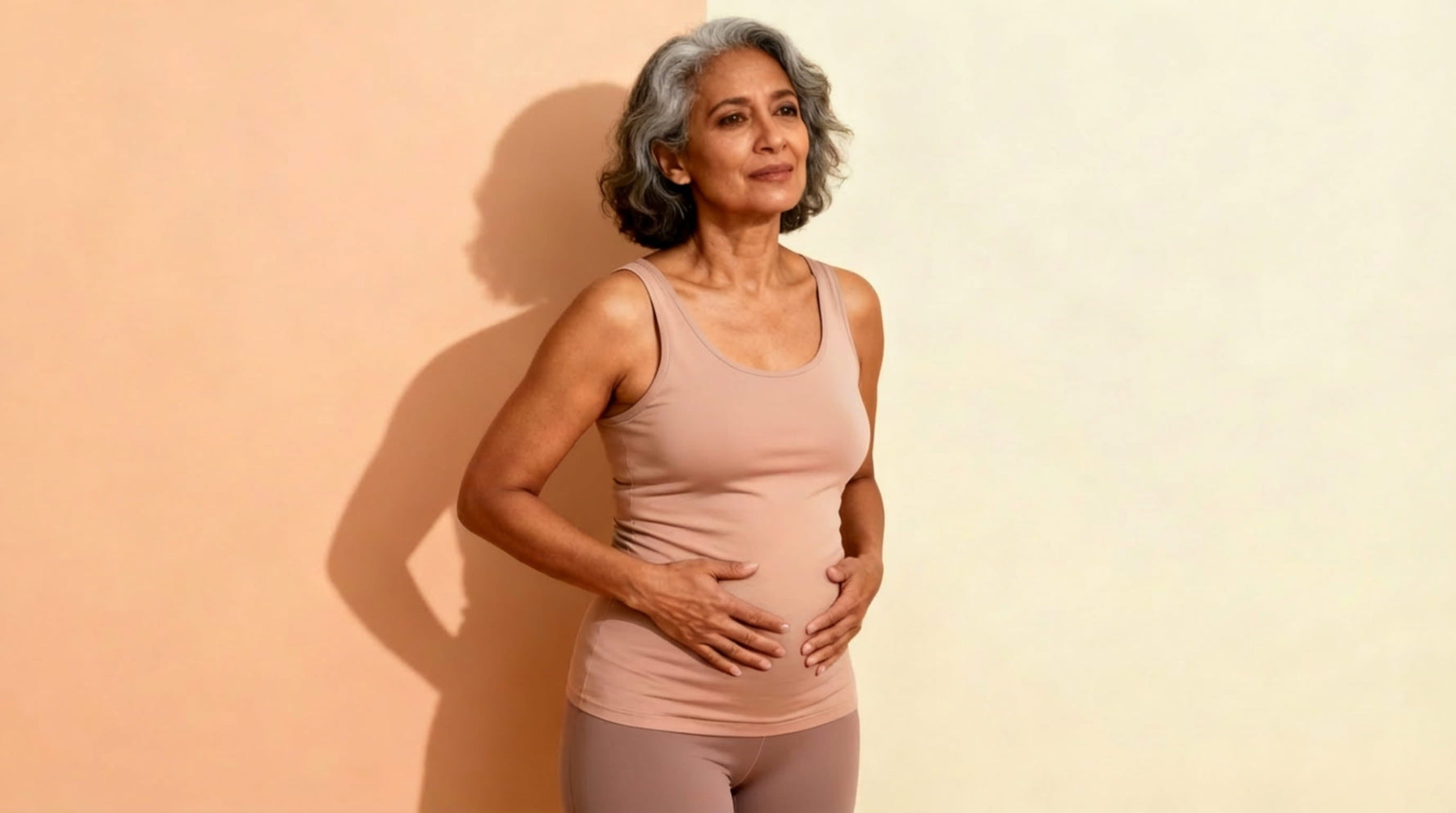 Woman holding her stomach feeling bloated